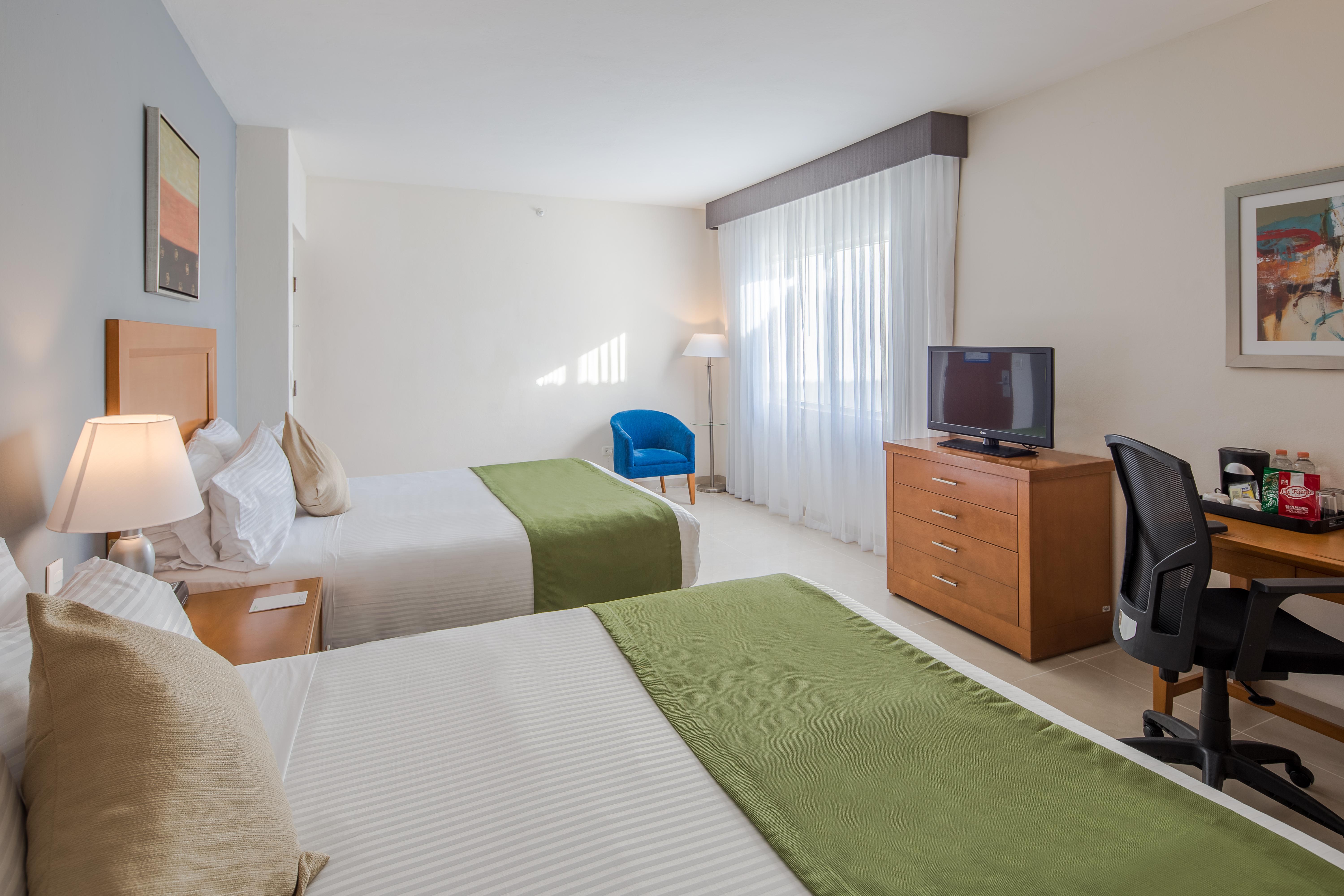 Отель Wyndham Garden Плая-дель-Кармен Экстерьер фото A typical hotel room